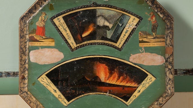 Interior of a painted and decorated octagonal work table.